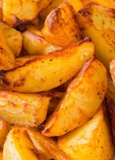 cooked potatoes with seasoning in a white bowl