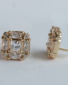 Elevate your style with our vintage-inspired earrings. These earrings feature a stunning moissanite centerpiece, accented by sparkling diamonds. Perfect for any occasion, these earrings will add a touch of elegance and sophistication to any outfit. A timeless piece that will never go out of style, these one-of-a-kind earrings will be a cherished addition to your jewelry collection. #diamondstuds #diamondearrings #moissanite #studearrings Wedding Earrings Vintage, Sparkle Diamonds, Moissanite Diamonds, Elevate Your Style, Wedding Earrings, Go Out, Out Of Style