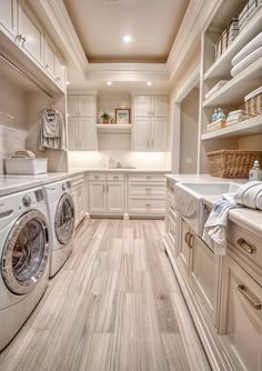 a very clean and organized laundry room with washer and dryer