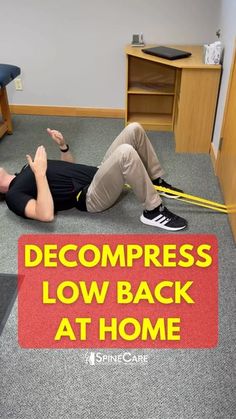 a man laying on the floor in front of a sign that says,'decompress low back at home '