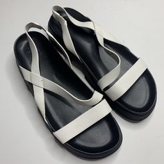 Great Looking Sandals In Brand New Condition. Everyday Synthetic Slingback Sandals For Spring, Casual White Sandals With Adjustable Strap, White Leather Slingback Sandals With Round Toe, White Flat Sandals With Adjustable Strap, White Slingback Sandals With Adjustable Strap, White Open Toe Slingback Sandals With Adjustable Strap, White Slingback Sandals With Branded Insole, White Slingback Sandals With Leather Footbed And Ankle Strap, White Synthetic Slingback Sandals With Open Heel