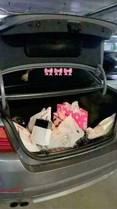 the trunk of a car filled with presents