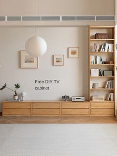 a living room filled with furniture and bookshelves next to a wall mounted tv