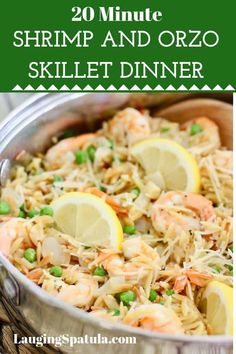 shrimp and orzo skillet dinner in a pan with lemons on the side