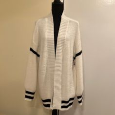 2bella White With Black Striped Trim 60% Cotton, 40% Acrylic Cardigan Sweater With Long Sleeves. Ribbing At Wrists, Front And Hem Line. Super Soft And Very Warm And Cozy. A Tunic Length Staple That You Can Wear With Everything! Never Worn. Nwot Size L White Trendy Acrylic Cardigan, Trendy White Acrylic Cardigan, White Acrylic Sweater Coat For Fall, White Acrylic V-neck Outerwear, White Knitted Acrylic Outerwear, Trendy White Sweater Coat, White Oversized Acrylic Outerwear, Soft Knit Acrylic Sweater Coat For Layering, Cozy Fitted Acrylic Cardigan