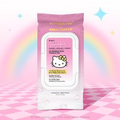 the hello kitty face wipe is on top of a pink checkered table with stars