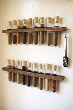 several spice jars are arranged on wooden shelves