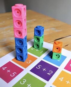 a game with blocks and numbers on the table