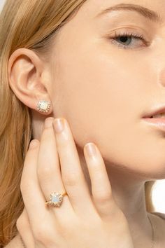 This enchanting gold-plated sterling silver ring showcases a round created white opal as the centerpiece, surrounded by a delicate arrangement of baguette and round cubic zirconia stones. The opal exhibits a mesmerizing iridescence, reflecting a spectrum of colors with every movement, while the sparkling stones add extra dimension and brilliance to the design. Halo Earrings, Stud Style, Halo Earrings Studs, Ring Sale, Cz Ring, White Opal, Beautiful Gift Boxes, Cz Stone, Gold Plated Sterling Silver