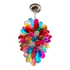 a multicolored glass chandelier hanging from a ceiling