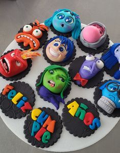 a birthday cake with monsters and numbers on it