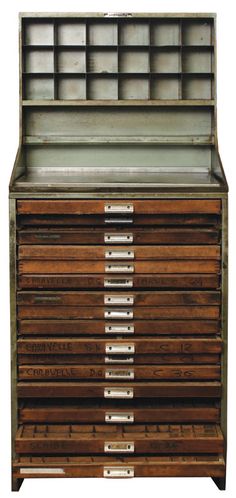 an old wooden cabinet with many drawers