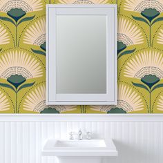 a white sink sitting under a mirror next to a wall