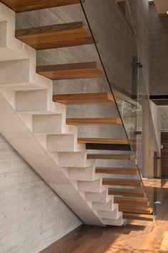 the stairs are made of concrete and wood