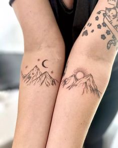 two people with matching tattoos on their arms