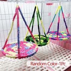 there are two swings made out of crocheted yarn