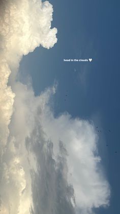 some clouds and birds flying in the sky