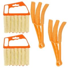 three orange and white combs on a white background