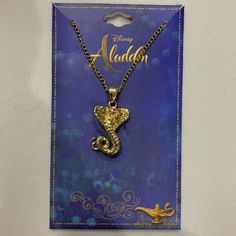 a necklace with a gold sea horse on it