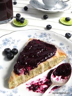 a piece of pie on a plate with blueberries