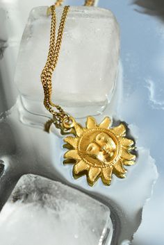 The sun necklace is a gold chain adorned with a beautiful sun pendant that adds a touch of elegance to any outfit. The intricate sun design is both eye-catching and unique, making it the perfect accessory for brightening up your day Material: stainless steel Length: 50 cm adjustable to 55 cm Summer Gold Jewelry With Sun And Moon Design, Gold Sun-shaped Jewelry For Everyday, Bohemian Yellow Gold Jewelry With Sun Design, Yellow Gold Brass Jewelry With Sun Design, Everyday Sun Design Pendant Necklace, Gold Sun Design Pendant Jewelry, Gold Plated Sun Design Pendant Necklace, Spiritual Sun Design Jewelry, Everyday Sun-shaped Jewelry With Sun Design