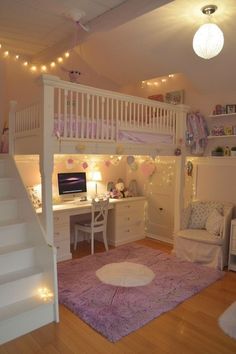 a loft bed with stairs leading to the top floor and desk area in front of it