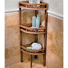 a bathroom corner shelf with soap and lotion on it