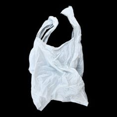 a white plastic bag on a black background