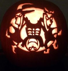 a carved pumpkin with an image of cats on it