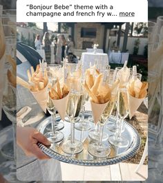 there is a tray with champagne and french fries on it that says, bonjou bebe'theme with a champagne and french fry v more