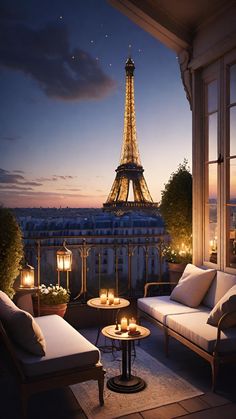 the eiffel tower is lit up at night with candles in front of it