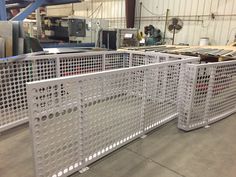 a large metal gate in a factory with lots of steel bars on the top and sides