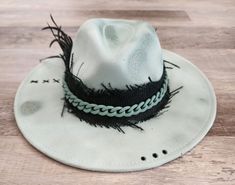 "Handmade Fedora hats with Western style bling. All hats are ONE OF A KIND and made personally by myself. Purposely aged to add lots of character! I enjoy creating unique items for others to enjoy in this mass produced world. Be UNIQUE... stand out in the crowd!  All hats are made to fit differently- this hat measures approx. 23.5\" with a tie to make adjustments allowing you to tighten the fit." Handmade Fedora With Short Brim As Gift, Handmade Short Brim Fedora As Gift, Custom Handmade Fedora, Custom Handmade Fedora Mini Hats, Handmade Flat Brim Fedora As Gift, Handmade Custom Mini Fedora Hats, Custom Handmade Mini Fedora Hat, Handmade Vintage Mini Fedora, Handmade Adjustable Top Hat As Gift