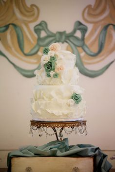 a wedding cake sitting on top of a table