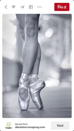 black and white photograph of a woman's feet in ballet shoes