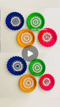 the video shows how to make colorful paper flowers