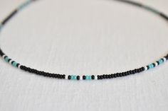 The Midnight Teal beaded choker is a luxurious accessory to wear while gazing at the stars. Trimmed in black and teal, this necklace will make you shimmer in the moonlight! The standard bedazzling choker is 13 inches long with an adjustable 2-inch extender chain to comfortably fit any size neck. If you would like a different length, please select the length you would like and I'll be happy to adjust it! Perfect for layering with other necklaces or chokers and great to wear with any outfit. It is Black Beaded Necklace For Beach With Tiny Beads, Beach Black Beaded Necklace With Tiny Beads, Black Beaded Choker For Beach, Black Beaded Beach Choker, Seed Bead Bracelet Patterns, Trendy Chokers, Seed Bead Choker, Beaded Necklace Patterns, Necklace Trendy