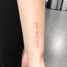 a person with a small tattoo on their arm