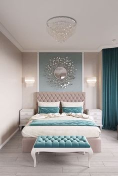 a bedroom with a large bed, blue curtains and a chandelier above it