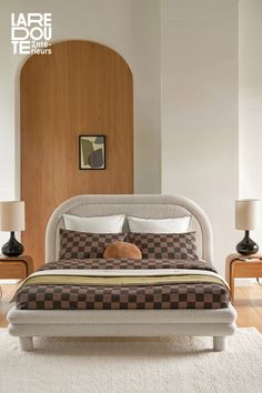 a dog is laying on top of a bed in the middle of a room with two nightstands