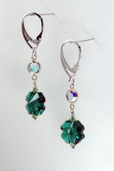 2 x 12mm Swarovski Crystal clover beads, green 2 x 6mm Swarovski Crystal links, Swarovski Crystal AB Sterling silver lever back earring clips Length of earring: 2 in. Diy Jewelry Unique, Clover Earrings, Swarovski Crystal Earrings, Crystal Ab, Jewelry Unique, Jewelry Inspo, Earrings Sterling Silver, Crystal Earrings, Swarovski Crystal