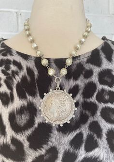 Silver Dollar Reproduction Coin Necklace, Coin Necklace With Pearls, - Etsy Silver Medallion Jewelry With Pearl Chain, Vintage Silver Jewelry With Pearl Charm, Silver Necklaces With Coin Pendant For Vintage Collection, Antique Silver Jewelry With Pearl Drop, Vintage Silver Jewelry With Pearl Chain, Vintage Silver Necklace With Pearl Chain, Silver Medallion Necklace With Pearl Charm, Antique Silver Pearl Jewelry, Vintage Silver Pearl Necklaces