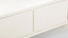 a close up of a white dresser drawer