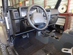 the interior of a vehicle with its dashboard and steering wheel in place for repairs or repair