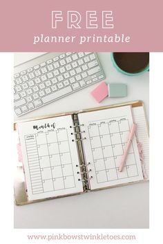 a planner with the words free printable on it and a keyboard next to it