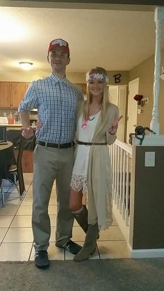 a man standing next to a woman in a living room