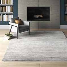 a living room with a chair, fireplace and bookshelves