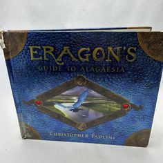 a book with the title eragon's guide to algesia on it