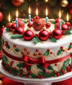 a decorated christmas cake with lit candles