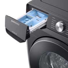 a samsung washing machine with its door open and water in it's drawer, on a white background